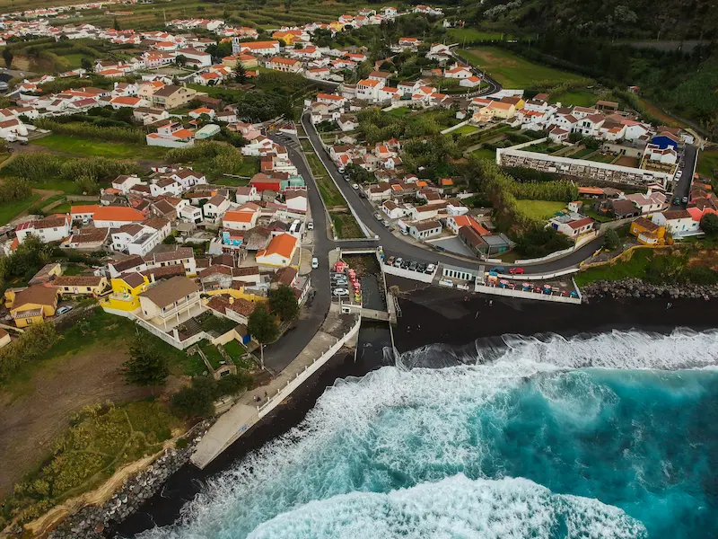 Aerial Top View Of Sea Waves Hitting A Beach With