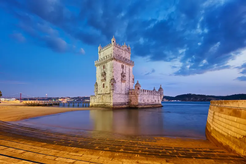 Belem Tower On The Bank Of The Tagus River In Twil
